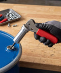 Premium High Carbon Steel Plunger Punch Tool For Size Six Drum Fasteners 0.158 Inch Inner Bore engaging a drum fastener.