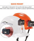 Quick mount feature of Skullerz 8987 Rechargeable Universal Hard Hat LED Light With Quick Mount Pivoting Magnet And Front Or Rear Slot Mount Built In USB-C Charging Go-To Portable Work Light For Construction Electrical And DIY Orange on white and orange helmets.