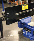 Bead Roller With Dies for Metal Fabrication, attached to bench vise in workshop, showing 19-inch throat industrial rotary forming machine.