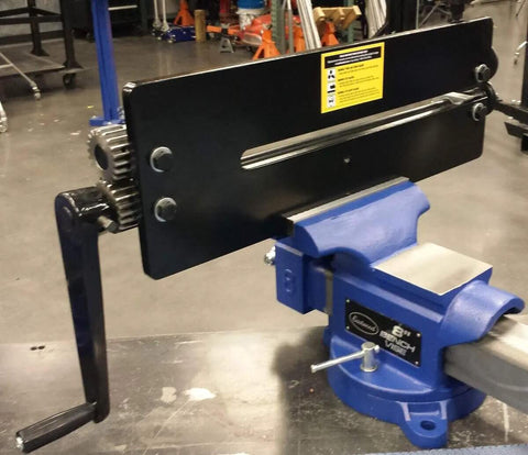 Bead Roller With Dies for Metal Fabrication, attached to bench vise in workshop, showing 19-inch throat industrial rotary forming machine.