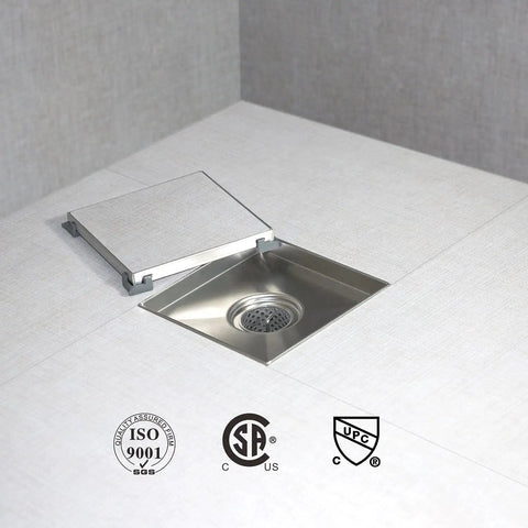 Top Notch 6 Inch Brushed Shower Drain With Full Flange Tile Insert And Blazing Fast X Shaped Diversion Groove For No Sweat Bathroom Water Runoff And Heavy Duty Everyday Life on a tiled surface.