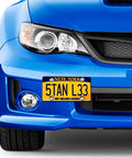 Front view of a blue car with a New York license plate secured using Anti Theft License Plate Screws Kit For Cars Tag Frame Holders Stainless Steel Mounting Hardware Tamper Resistant Security Screw Set 1 Quarter Inch M6 Rust Proof Chrome Caps ZXFOOG.