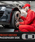 Mechanic working on front driver passenger side wheel of a black car on a lift in a garage.