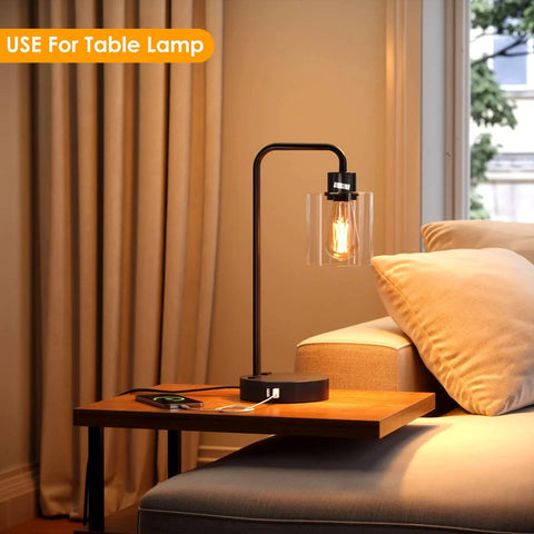 Table lamp with Six Pack Clear Glass Lampshades Set For Pendant Lights Floor Lamps Chandeliers, lit on a wooden table.
