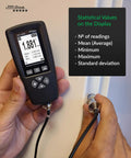 Rugged Coating Thickness Meter for Steel and Aluminum Structures, 0-3000µm Range, 0.001 Mil Resolution, External Probe, Fe/NFe Auto Detection, USB Data Export, Built for Inspectors, Contractors, and QC Pros On the Jobsite. Handheld gauge with external probe showing statistical readings.