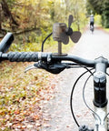 Portable Wind Turbine 5W USB Charger For Smartphones And Tablets installed on a bicycle handlebar for outdoor use