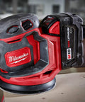 Slick Cordless Random Orbit Sander Kit With M18 Battery Pack For Smooth Wood Finishing And Metal Prep, red and black ergonomic design.
