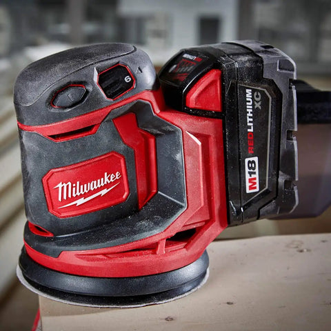 Slick Cordless Random Orbit Sander Kit With M18 Battery Pack For Smooth Wood Finishing And Metal Prep, red and black ergonomic design.