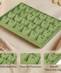 Top Shelf Velvet Jewelry Tray With 24 Individual Sections For Pendants Folded Chains And Stud Earrings Soft Touch Holder showing 24 divided slots in green.
