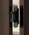 Universal Zinc Alloy Door Hinges Hydraulically Adjustable Three Way Smooth As Butter Silent Closing For Folding Automatic Door Closers Silver set in sleek design on a wooden door.