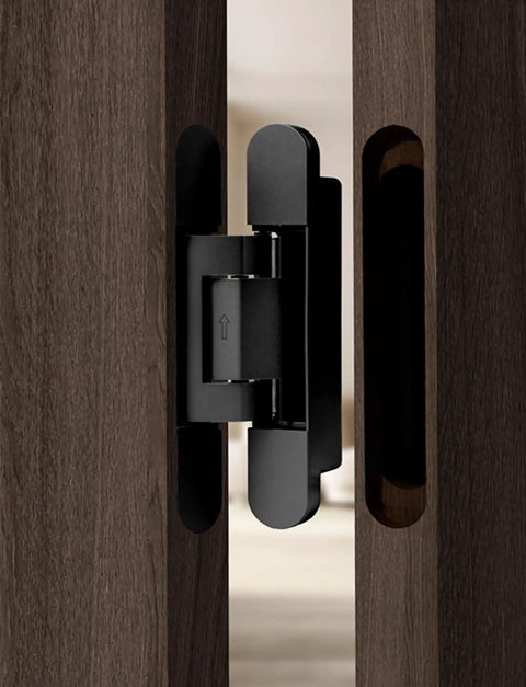 Universal Zinc Alloy Door Hinges Hydraulically Adjustable Three Way Smooth As Butter Silent Closing For Folding Automatic Door Closers Silver set in sleek design on a wooden door.