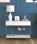 28.25 Inch Tall Porcelain Table Lamp With White Drum Fabric Shade Candlestick Base on modern console table against blue wall.
