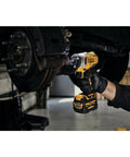 12V Max 3/8 Inch Cordless Impact Wrench Kit in use on vehicle brake assembly, showcasing compact design and robust handling.