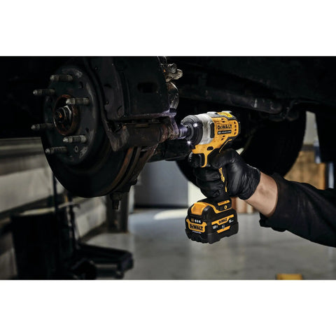 12V Max 3/8 Inch Cordless Impact Wrench Kit in use on vehicle brake assembly, showcasing compact design and robust handling.
