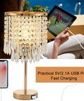 Gold Crystal Table Lamps Set Of 2 With USB Ports And 3-Way Touch Dimmer next to a person charging a tablet outdoors.