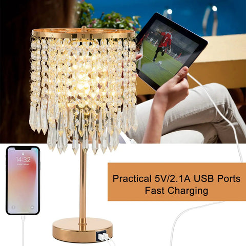 Gold Crystal Table Lamps Set Of 2 With USB Ports And 3-Way Touch Dimmer next to a person charging a tablet outdoors.