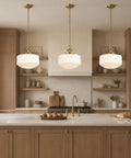 Vintage Brass Milk Glass Pendant Lights Fixture, Pleated Glass Chandelier hanging over a kitchen island with wood cabinets.