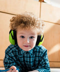 Child wearing green 4 Pack Kids Ear Muffs Noise Canceling 26dB Adjustable Headphones for Safe Sound and Everyday Noise Reduction