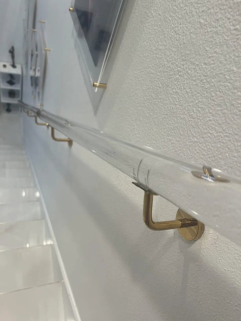 Heavy Duty Custom Acrylic Handrail Kit For Stairs Featuring Clear Lucite Finish attached to wall with gold supports