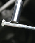 Flexible Magnetic Pickup Tool With 24 Inch Reach And 4 Pound Capacity retrieving a metal bolt from tight space
