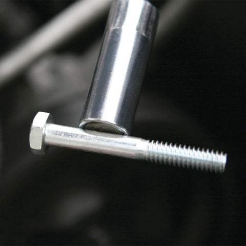 Flexible Magnetic Pickup Tool With 24 Inch Reach And 4 Pound Capacity retrieving a metal bolt from tight space