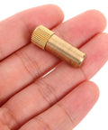 Four Pack Copper Shelf Pins For Cabinets And Furniture, Antique Style, Heavy Duty Pegs in hand showcasing rust resistant copper material.