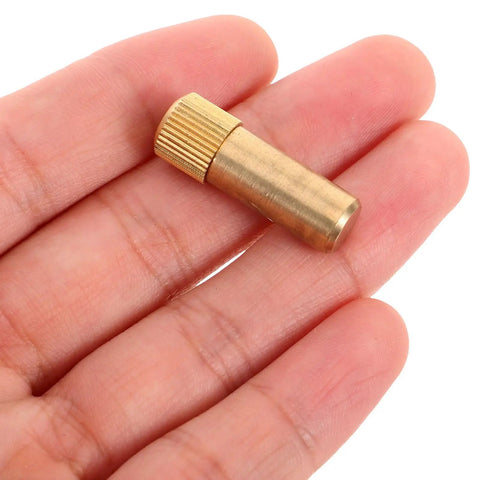 Close-up of a single brass shelf support peg from 4 Pack Brass Shelf Support Pegs For Cabinets And Furniture Easy Install Golden Antique Style Shelf Pins For Bookshelves And Bookcases Sturdy Hardware To End Wobble And Keep Shelves Secure.