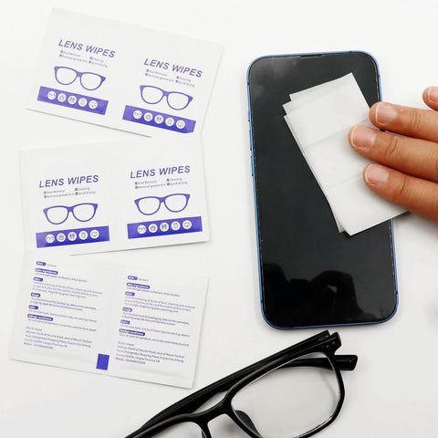 Using Alcohol Free Lens Wipes For Glasses And Screens Streak Free 220 Count on a smartphone next to glasses and packaging