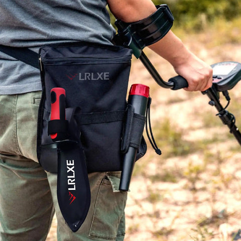 Person using metal detector with Heavy Duty Double Serrated Edge Digger With Sheath For Metal Detecting And Gardening A Tough As Nails Tool.