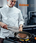 Chef using Extra Long BBQ Tongs Set Of Two 12 Inch And 17 Inch Stainless Steel Grillin Tongs With Locking Mechanism cooking steak