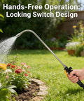 Person using Stainless Steel Watering Wand Sprayer For Garden Hose with locking switch, watering garden flowers outdoors.