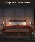 Cozy bedroom with twin nightstands, each with White Ambiance 60W LED Smart Light Starter Kit With Hub And Smart Button Two Pack