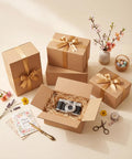 Assorted Shipping Boxes 30 Pack Value Pack with camera, ribbon-wrapped boxes, floral decor, and spring greeting card.