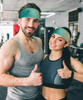 Man and woman wearing sweat-wicking headbands for sports and workouts, ultra wide 11cm hairband, in gym setting.