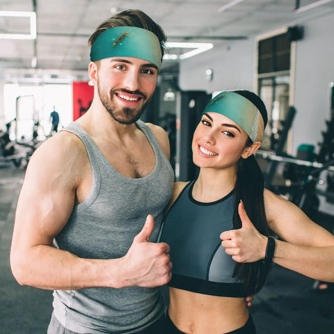 Man and woman wearing sweat-wicking headbands for sports and workouts, ultra wide 11cm hairband, in gym setting.