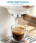 Compact Espresso Maker With 20 Bar Pressure And Built In Milk Frother Semi Automatic Coffee Brewer extracting espresso into glass.