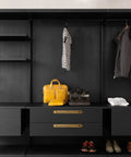 Closet with drawers featuring antique brass zinc alloy cabinet handle with backplate and bags for visual context.
