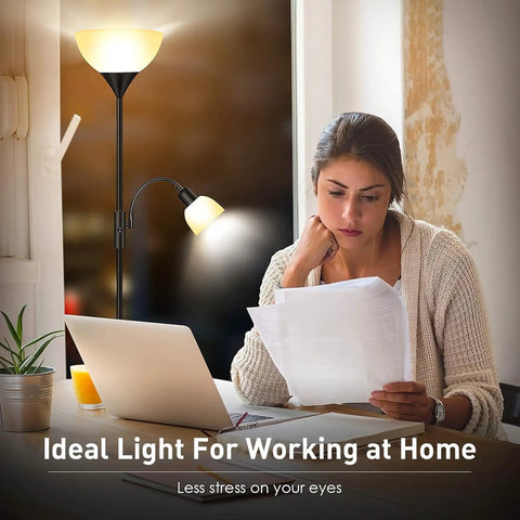 Tall Torchiere Floor Lamp With Adjustable Reading Light next to a woman reading at a desk, 71-Inch Tall Pole visible.