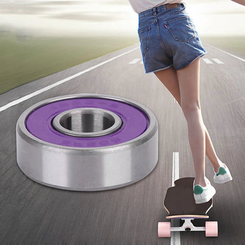 Pro Grade Roller Ball Bearings Kit For Skateboard And Scooter With Purple Cover ABEC9 Deep Groove Pre Lubricated For Smooth Low Friction Ride And Long Lasting Durability, purple bearing close-up on road