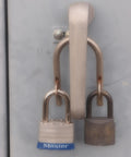 Super Secure Dual Padlock Gate Lock Killing Messy Daisy Chains For Hella Tough Barn Yard Protection Letting Two Different Property Owners Use Their Own Separate Keys on a dual padlock hasp.