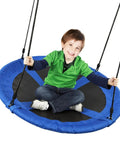 Child sitting on 40 Inch Saucer Tree Swing With 600 Pound Capacity Includes 2 Straps And Carabiners Pillow Waterproof 900D Oxford Seat Steel Frame For Kids And Adults Backyard Blue.