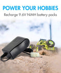9.6V NiMH NiCd RC Battery Charger With 400mA AC Plug And Standard Tamiya Connector For 8S Packs next to RC car