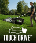 Man using Cordless Self Propelled Electric Lawn Mower With Select Cut Blades And Touch Drive on grass
