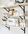 Interior shelves supported by 12 Pack 14 Inch Beefy Heavy Duty Shelf Brackets For Garage Storage Shelves Black Powder Coat Finish With 800 Pound Load Capacity Large Floating Wall Mount Brackets For Strong Workshop And Home Use Includes Screws Anchors And Level, with decor items.