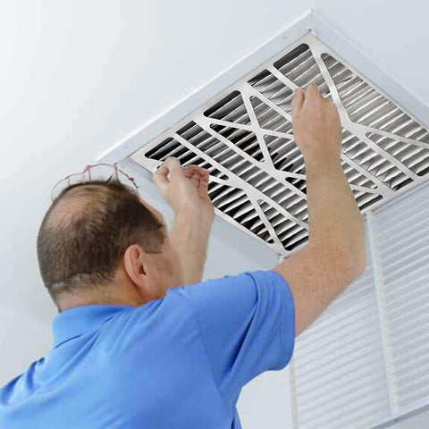 Man installing Air Bear 20 x 25 x 5 Inch MERV 8 High Performance Air Purifier Filter Replacement in ceiling vent