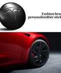 Set Of Four Aluminum Waterproof Wheel Cover Center Emblem Sticker For Tesla Model 3 And Model Y 56mm Hubcaps Rim Cover Matte Black Finish For A Sleek Oem Look And Rugged Daily Driver Upgrade, showing close-up of matte black hubcap on red Tesla.