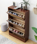 Ultra Slim Wooden Shoe Rack With Swinging Doors And Wide Top Counter Built For Tight Hallways And Mudrooms To Keep Your Kicks Stacked In A Super Slick Walnut Finish with shoes organized.