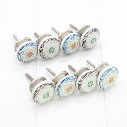 Pack Of Eight Vibrant Mandala Ceramic Cupboard Knobs 40mm Drawer Pulls With Washers on a white surface.