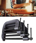 The Ultimate 4pcs C Clamps Set With Versatile Sizes Including 3 Inch, 4 Inch, 6 Inch And 8 Inch For Heavy Duty Woodworking, Welding, Carpentry And Furniture Assembly Made From Thickened Industrial Steel That Totally Slaps displayed in workshop with a woodworker.