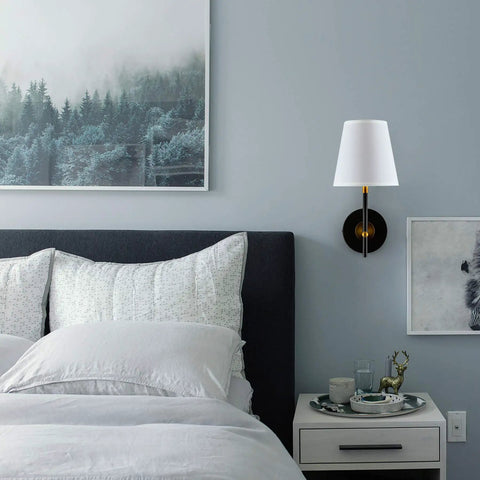 Bedroom with 1 Light Wall Sconce With Plug In Cord And White Fabric Shade In Matte Black Finish above nightstand.